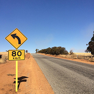 80km left turn sign outside of Dumbleyoung, Western Australia