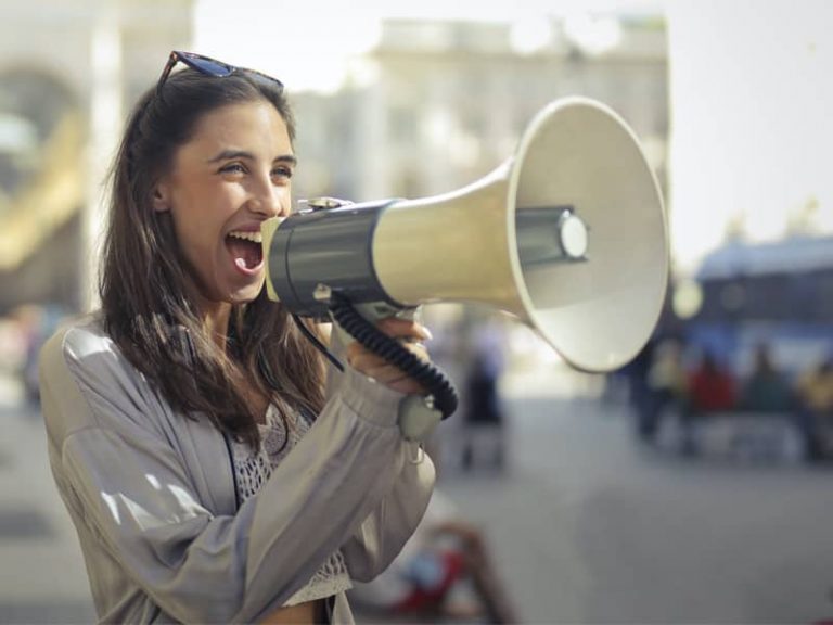 Lady shouting into a megaphone