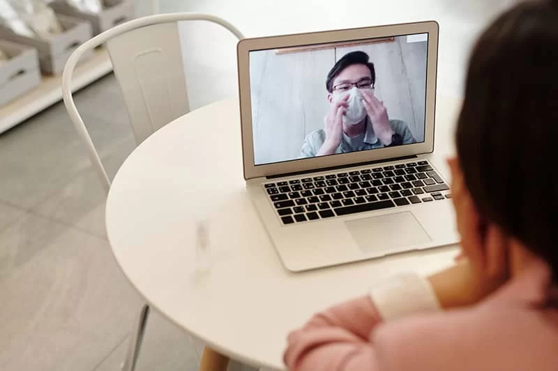 A doctors appointment by remote video conference on a laptop