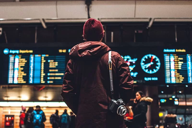 A travel photographer in an airport