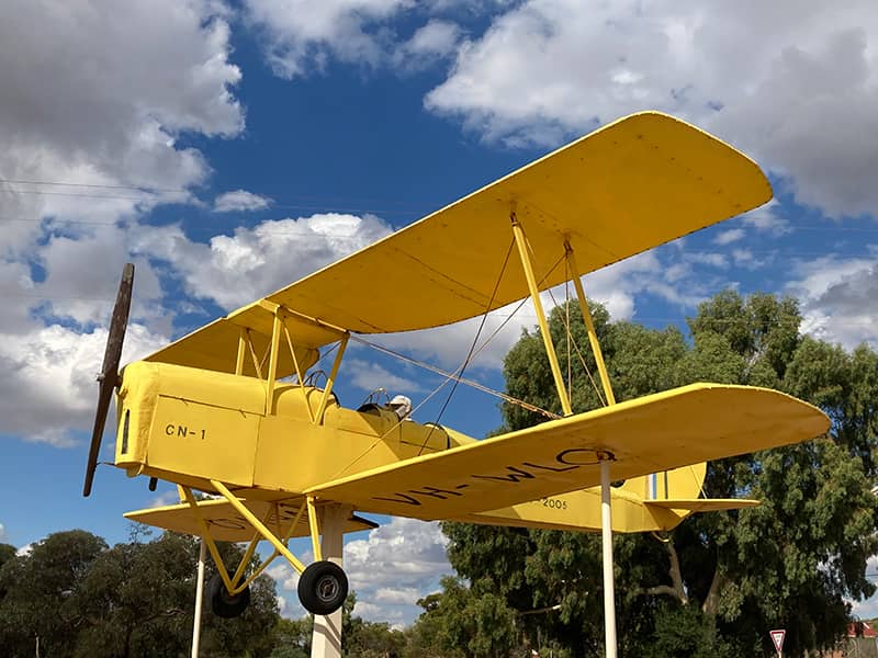 A yellow airplane on display in Cunderdin, Western Australia