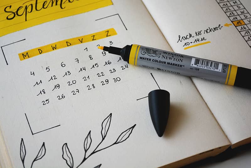 A calendar with a yellow highlighter on top