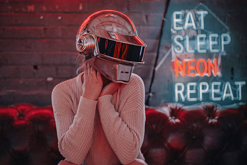 A girl wearing a cyberpunk helment