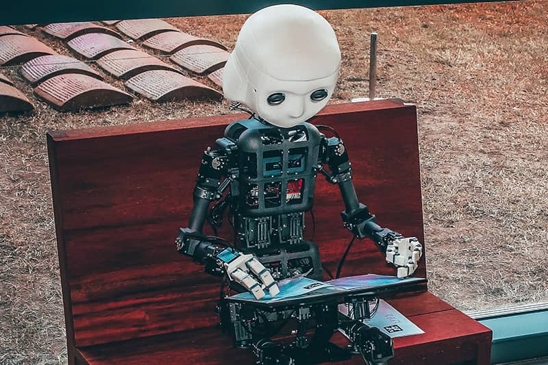 A robot reading a booklet